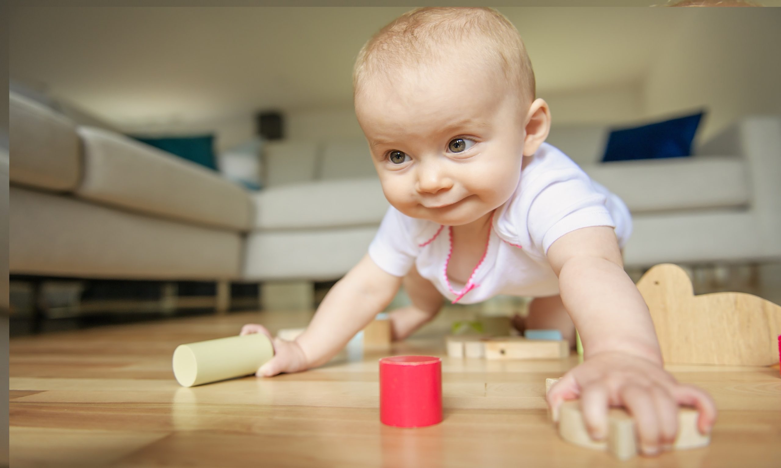 crawling funny baby indoors at home play with block